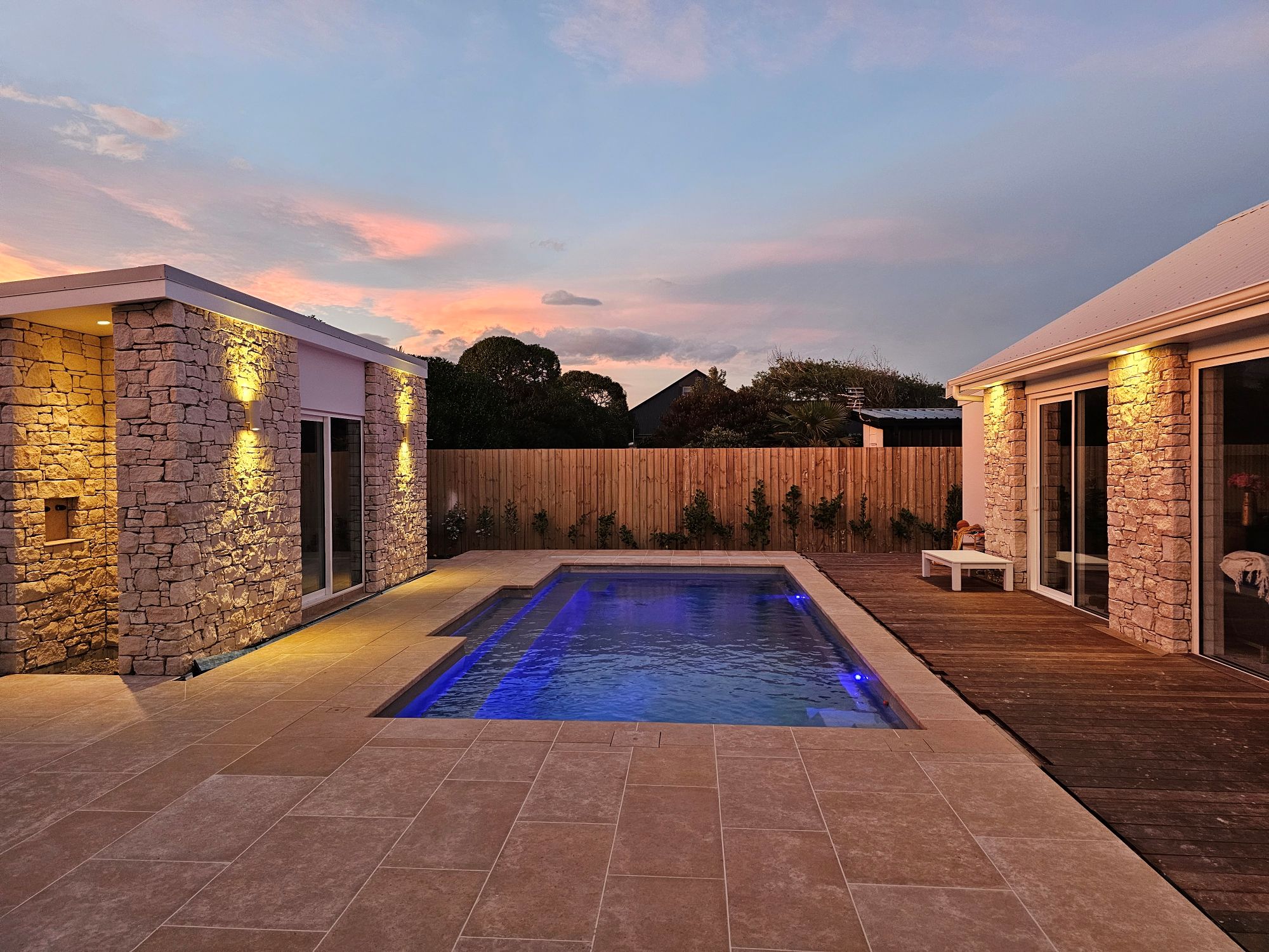 Marine Parade - swimming pool at twilight with limestone surrounds and feature lighting