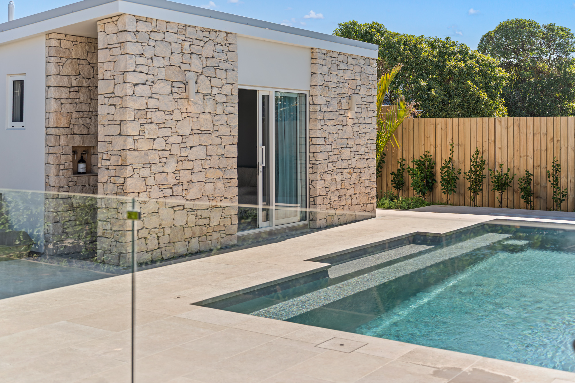 Marine Parade - swimming pool with West Coast limestone walls and pool house entry