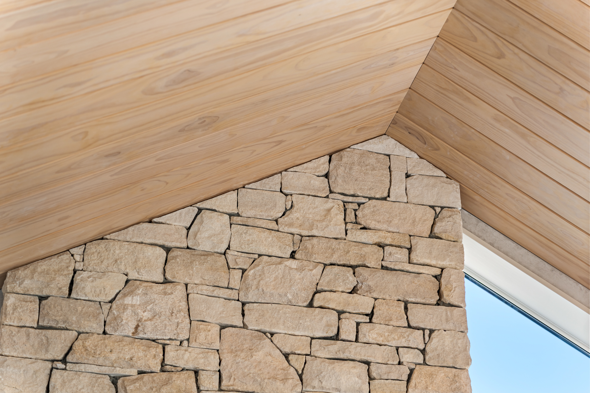Marine Parade - architectural detail of West Coast limestone wall meeting cedar ceiling