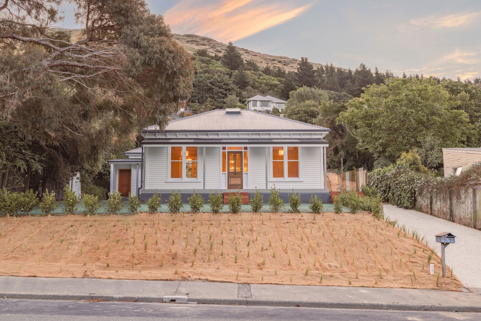 Port Hills Road - sage living room with timber joinery and garden views