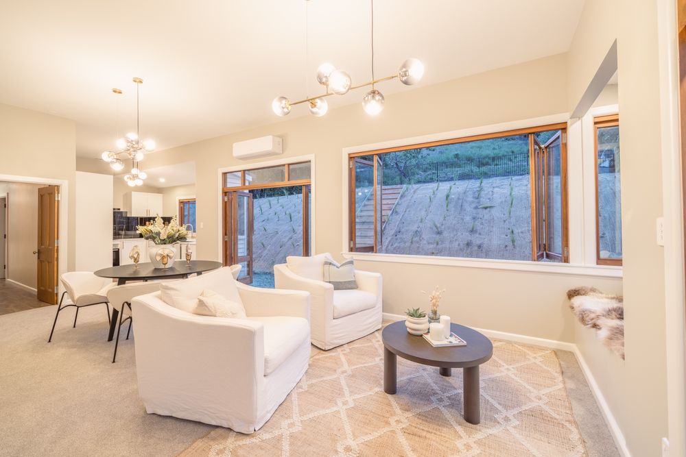 Port Hills Road living and dining with sputnik chandelier