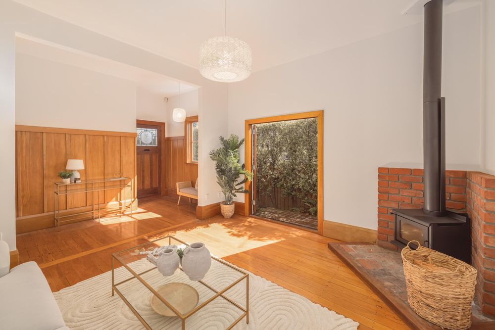 Woodville Street living room with fireplace and timber floors